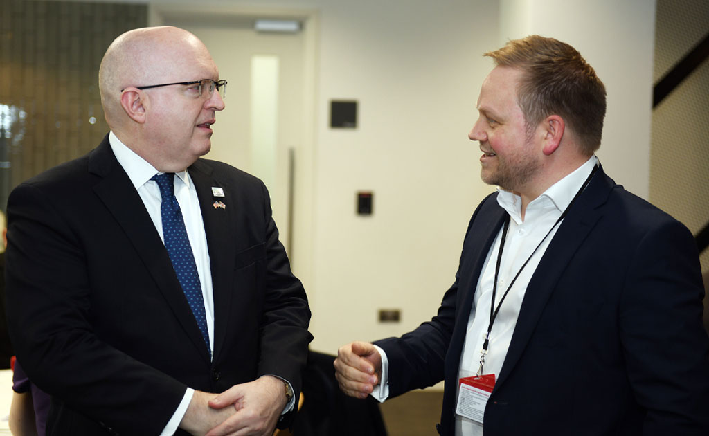 Flexeserve CEO, Jamie Joyce speaking with U.S. Embassy Chargé d'Affaires, Ambassador Philip T Reeker