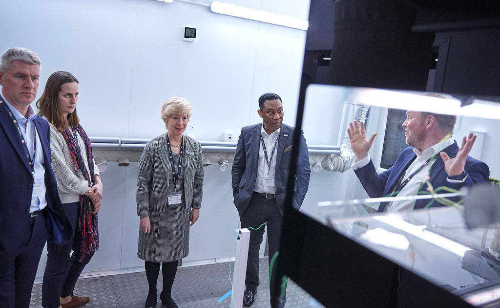 Jamie Joyce demonstrating their world-first Environmental Test Chamber for heated displays in their dedicated R&D department