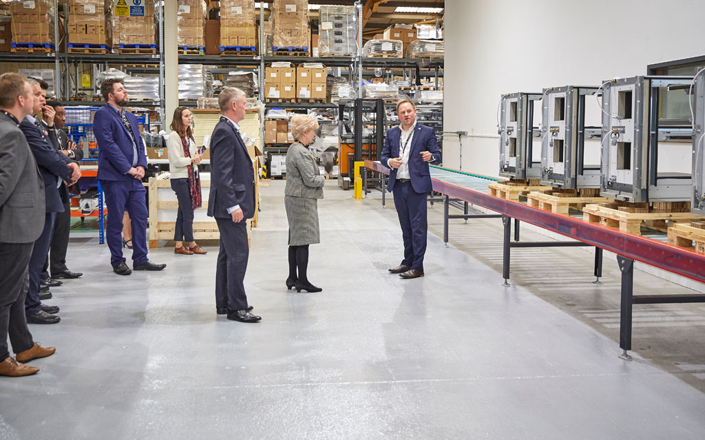 Jamie Joyce giving a tour of Flexeserve's production facilities to members of the U.S. Embassy and Greater Birmingham Transatlantic Chamber of Commerce