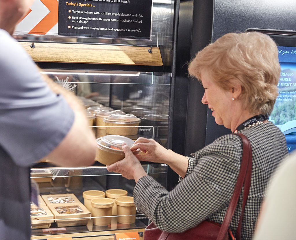 Rosemary Gallant from the U.S. Embassy sampling lunch from a Flexeserve Zone heated display