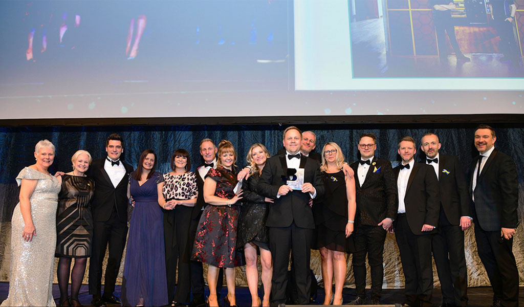 The Flexeserve team, patrons of Greater Birmingham Chambers of Commerce, on stage with their Excellence in Sales & Marketing Award at GBCC Awards 2022
