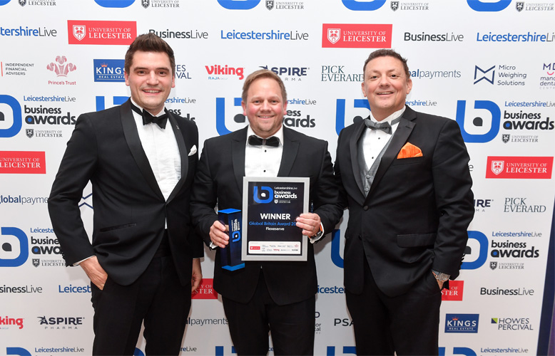 Being presented with the Global Britain Award 2023 are [L-R] Warwick Wakefield, Director of Customer Experience for Flexeserve; Jamie Joyce, Global CEO of Flexeserve; Dave Hinton, President of Flexeserve Inc.