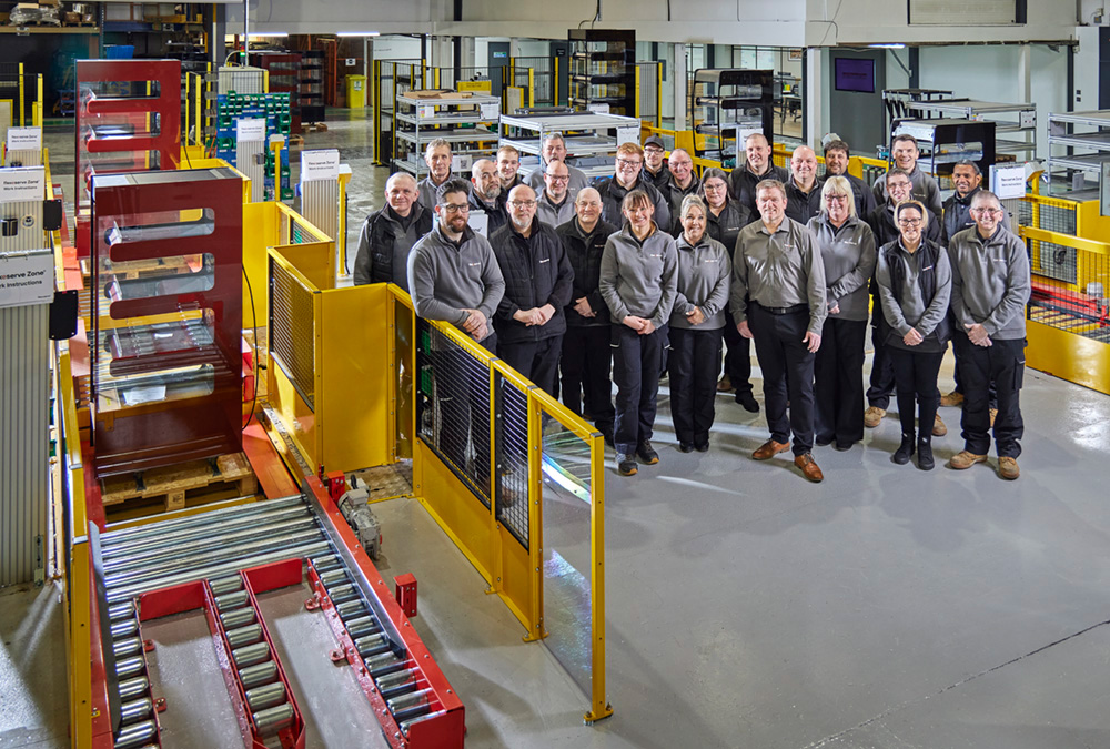 Flexeserve team members next to the new semi-automated production lines