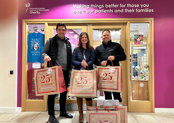 Jamie Joyce, Global CEO and Warwick Wakefield, Director of Customer Experience, for Flexeserve, donating toys to University Hospitals Coventry and Warwickshire (UHCW)