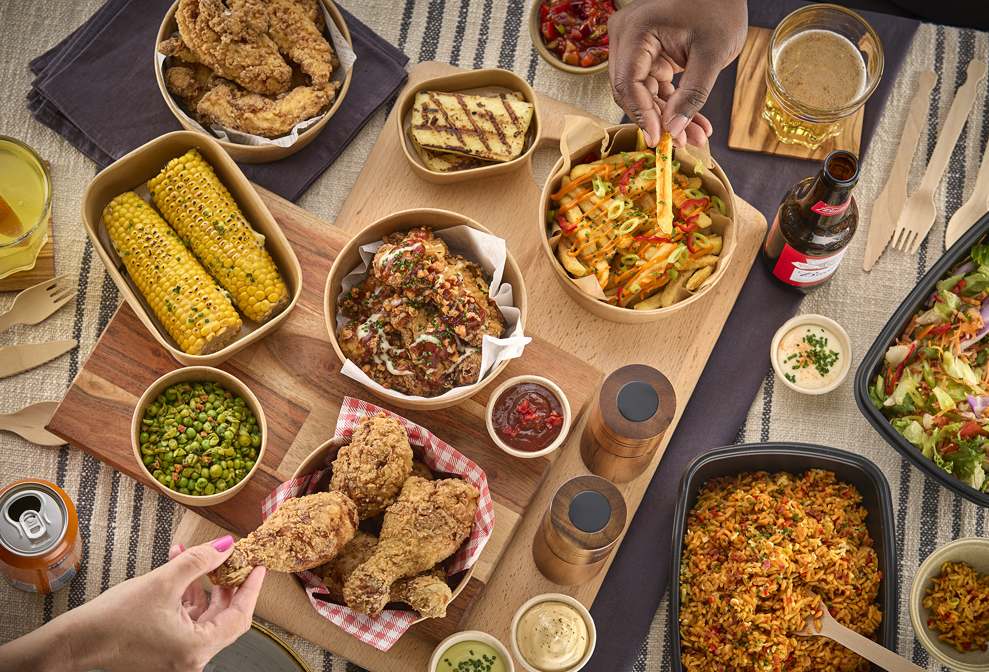 A variety of hot food-to-go comprising mains and sides, hot-held by Flexeserve's unique multi-temperature heated displays to maintain amazing food quality
