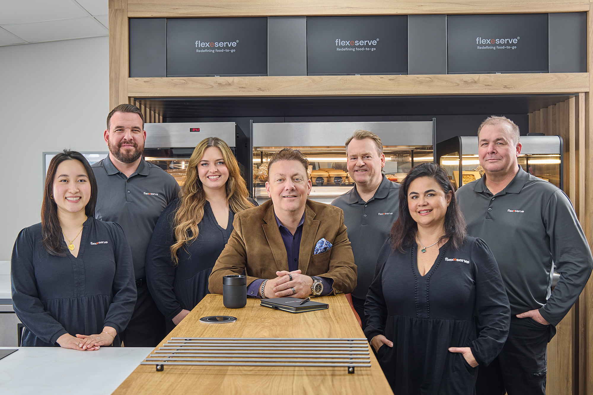 Flexeserve Inc. President Dave Hinton (centre) and Operations Manager Ericka Randell (right), together with members of the Americas-based food-to-go hot-holding team