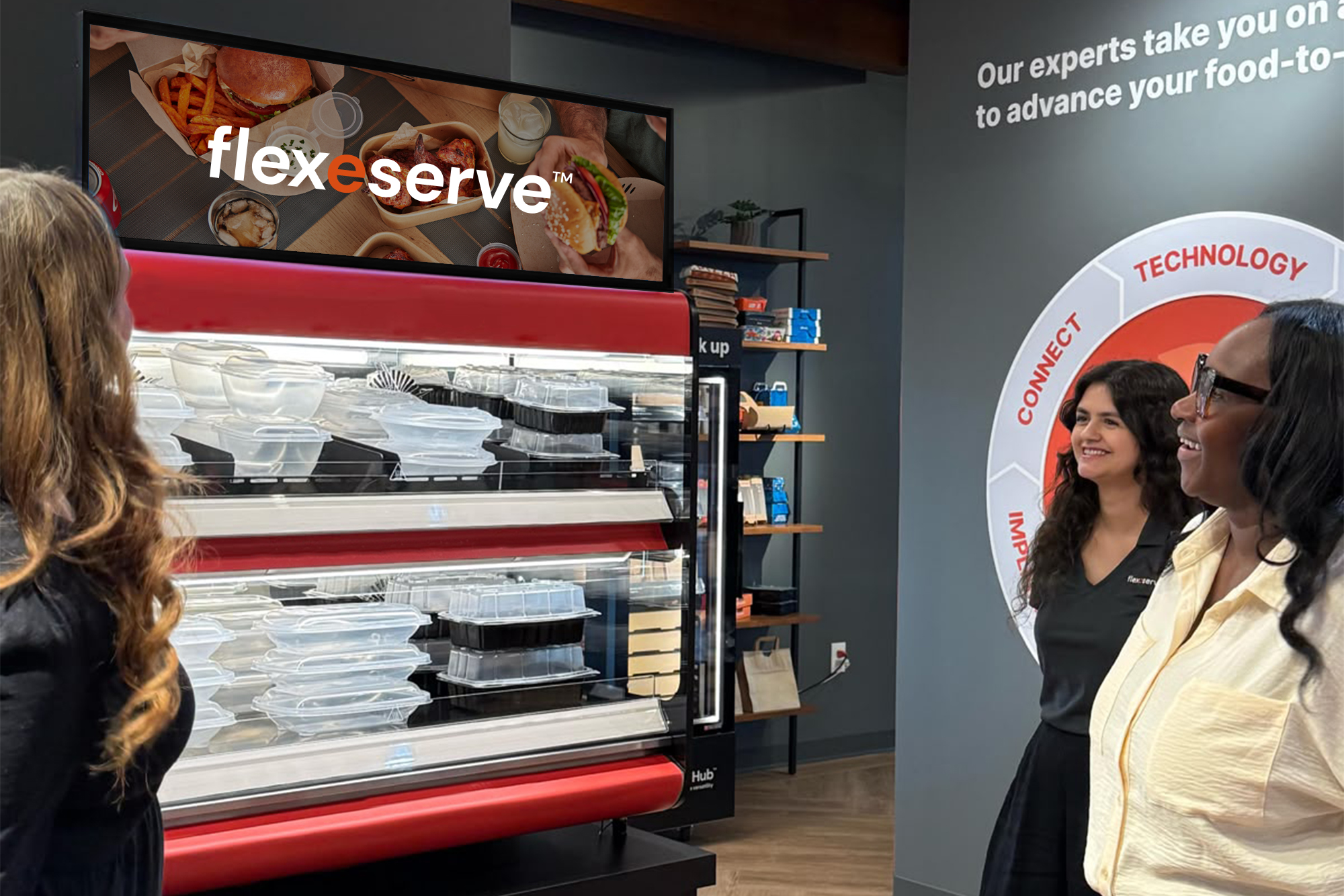 Rachel Paul [left] and Meagan Crouch [center] welcome a guest to Flexeserve's U.S. HQ in Southlake (Dallas), TX